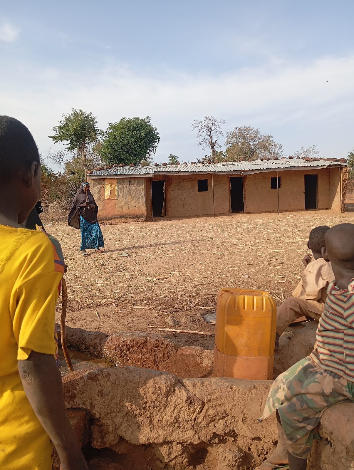 Children walking to school along a Kwara road